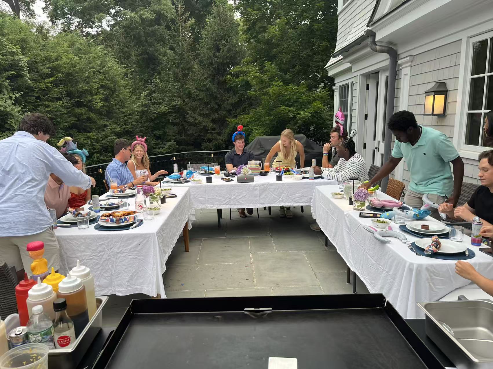 Backyard hibachi private party setup with guests