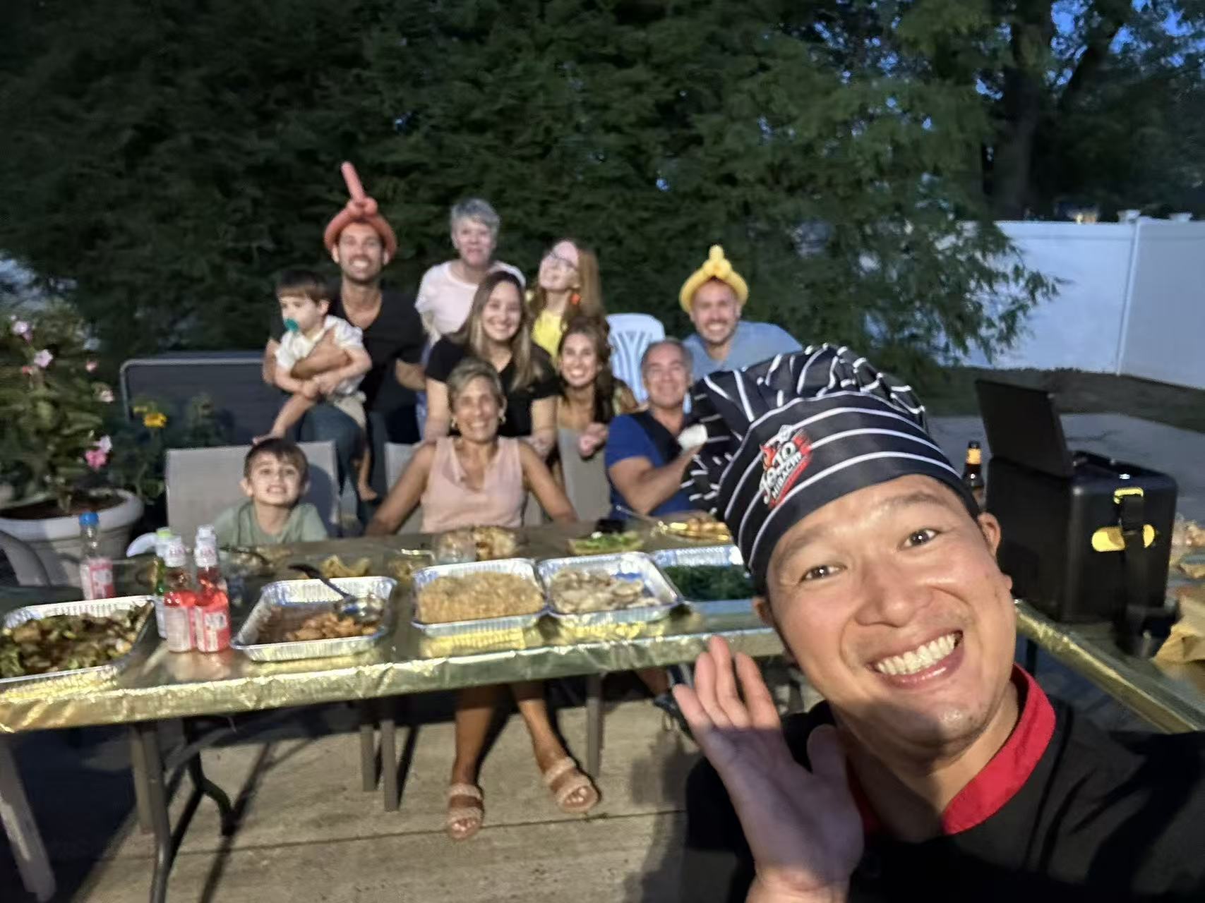 Private hibachi chef entertaining guests